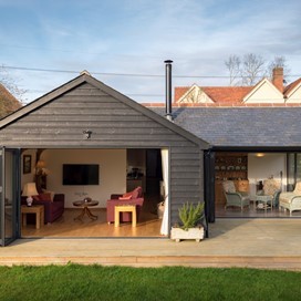 Even Bi-fold sets create a shrine of natural light to illuminate this modern bungalow.