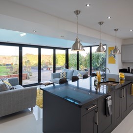 A new lease of life given to this orangery, with a hint of yellow, styled kitchen extension by multi-functional Jet Black Origin products. 