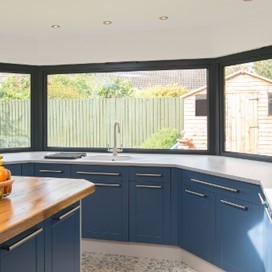 A large bay window from inside the kitchen of the recently renovated property