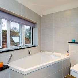 An internal view of an open bathroom windows and blind