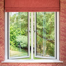 Large origin window half open and slightly covered by red blinds