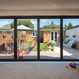 The Origin Slimline OB-49 Bi-fold Door helps fill this home with natural light