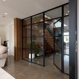 An experienced commercial and residential interior designer, partitioned his property with Black Grey Internal Doors