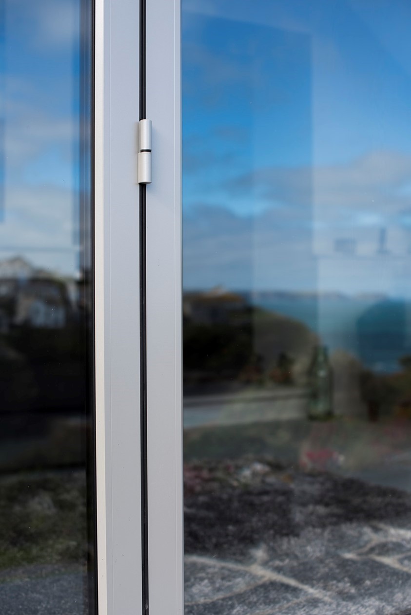 Close up of a closed white bifold door